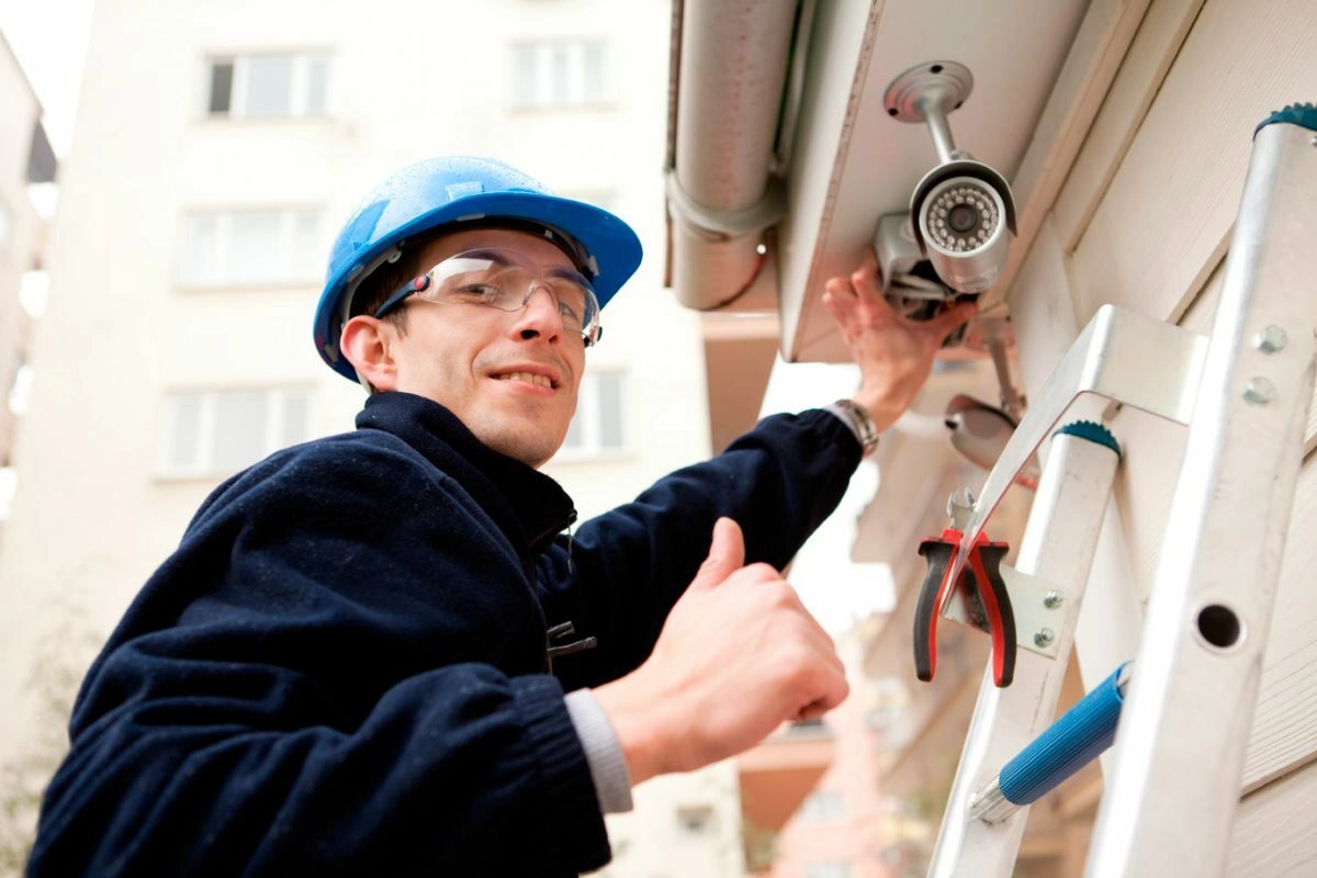 CCTV technician installing a security camera